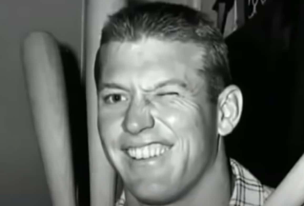 Mickey Mantle hitting a World Series home run, showcasing his playoff excellence.